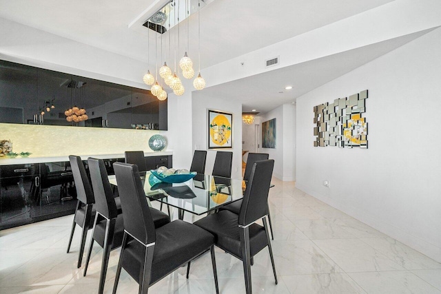 2640 Lake Shore Dr Unit 2307, Riviera Beach, FL 33404 - dining space with a chandelier, baseboards, light marble finish flooring, and recessed lighting