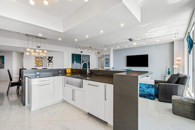 2640 Lake Shore Dr Unit 2307, Riviera Beach, FL 33404 - kitchen with open floor plan, a sink, light marble finish floors, rail lighting, and recessed lighting