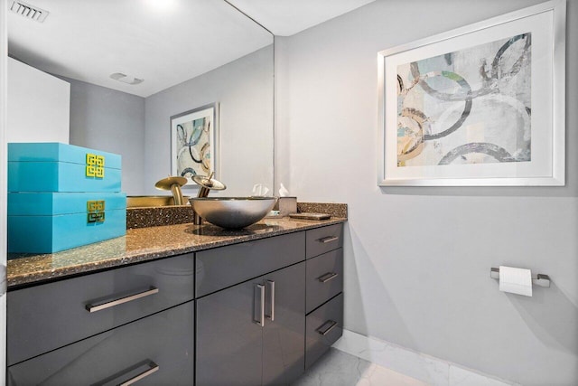2640 Lake Shore Dr Unit 2307, Riviera Beach, FL 33404 - bathroom with vanity, marble look tile flooring, and baseboards