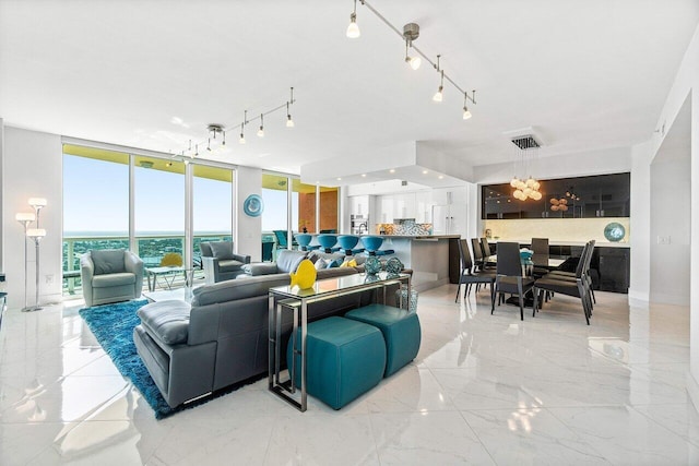 2640 Lake Shore Dr Unit 2307, Riviera Beach, FL 33404 - living area with expansive windows and light marble finish flooring