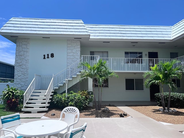118 Yacht Club Dr Unit 7, North Palm Beach, FL 33408 - view of building exterior featuring stairs