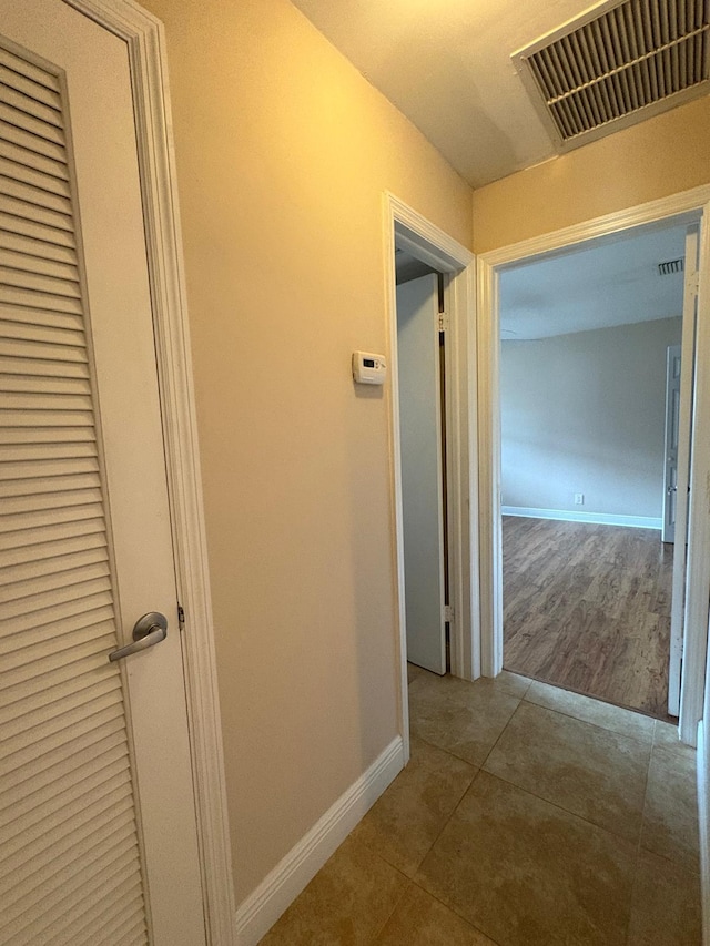 118 Yacht Club Dr Unit 7, North Palm Beach, FL 33408 - corridor with tile patterned flooring and baseboards