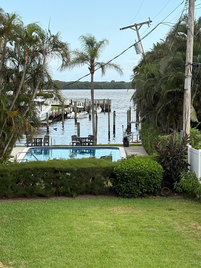 118 Yacht Club Dr Unit 7, North Palm Beach, FL 33408 - dock featuring a lawn and a water view