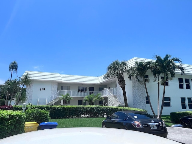 118 Yacht Club Dr Unit 7, North Palm Beach, FL 33408 - view of building exterior with stairway