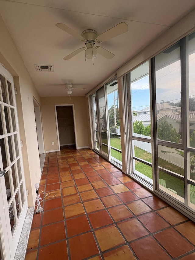 118 Yacht Club Dr Unit 7, North Palm Beach, FL 33408 - unfurnished sunroom featuring tile patterned flooring and baseboards