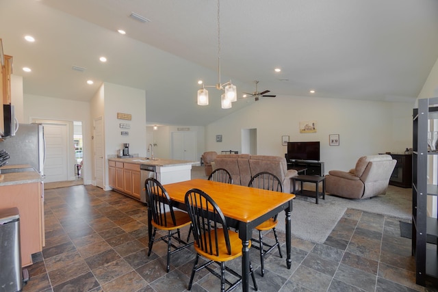 517 SW Cherryhill Rd, Port Saint Lucie, FL 34953 - dining area featuring vaulted ceiling, a chandelier, dark stone finish floors, and recessed lighting