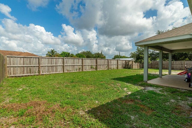 517 SW Cherryhill Rd, Port Saint Lucie, FL 34953 - fenced backyard featuring a patio