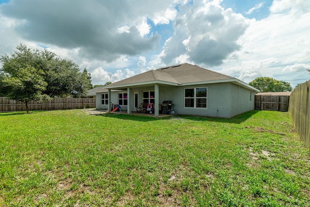 517 SW Cherryhill Rd, Port Saint Lucie, FL 34953 - back of house with a patio, stucco siding, and a fenced backyard