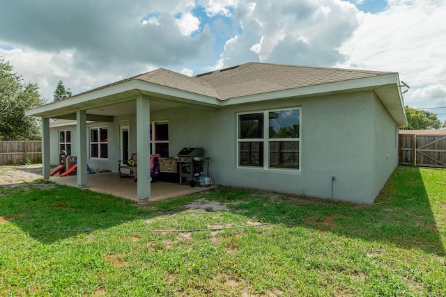 517 SW Cherryhill Rd, Port Saint Lucie, FL 34953 - rear view of property with stucco siding and a patio area