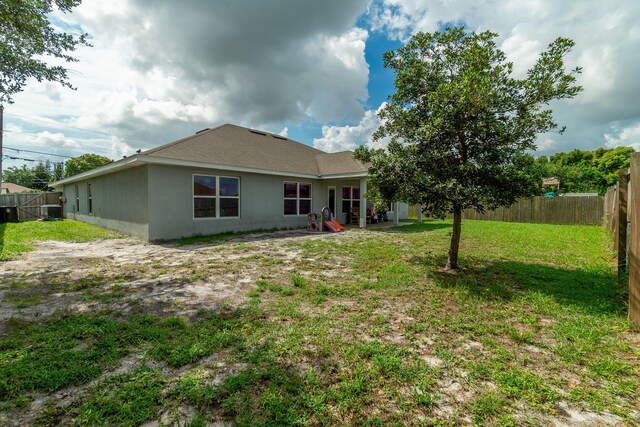 517 SW Cherryhill Rd, Port Saint Lucie, FL 34953 - back of house with stucco siding