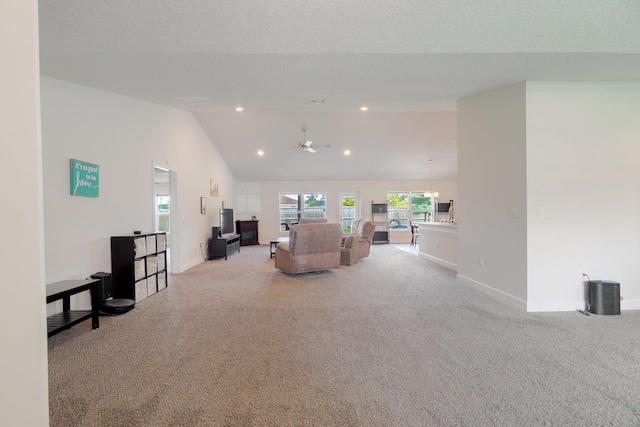 517 SW Cherryhill Rd, Port Saint Lucie, FL 34953 - carpeted living area with baseboards, ceiling fan, vaulted ceiling, and recessed lighting