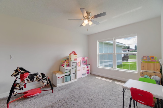 517 SW Cherryhill Rd, Port Saint Lucie, FL 34953 - rec room featuring baseboards, carpet floors, and a ceiling fan