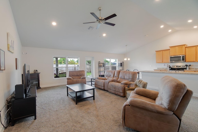 517 SW Cherryhill Rd, Port Saint Lucie, FL 34953 - living room featuring recessed lighting, healthy amount of natural light, light carpet, high vaulted ceiling, and ceiling fan