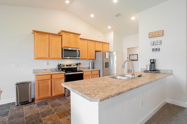 517 SW Cherryhill Rd, Port Saint Lucie, FL 34953 - kitchen featuring stainless steel appliances, a peninsula, light countertops, vaulted ceiling, and recessed lighting