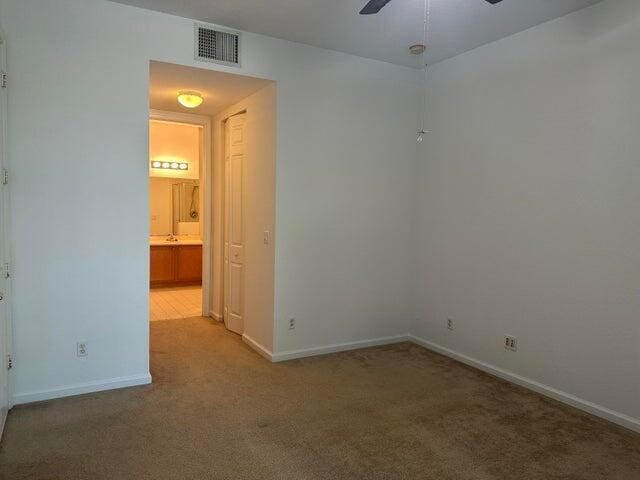 10280 SW Stephanie Way Unit 8209, Port Saint Lucie, FL 34987 - carpeted spare room featuring a ceiling fan and baseboards