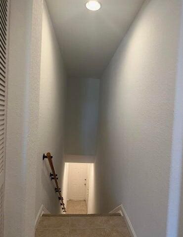10280 SW Stephanie Way Unit 8209, Port Saint Lucie, FL 34987 - staircase featuring baseboards and recessed lighting
