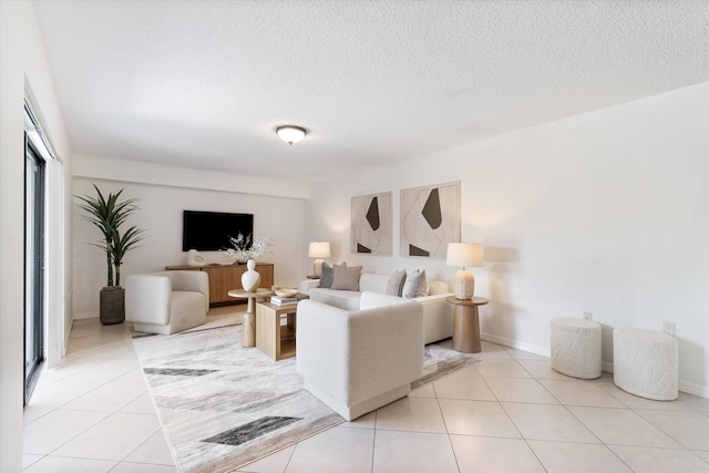 744 Buttonwood Ln Unit 411-D, Boynton Beach, FL 33436 - living room with light tile patterned floors and a textured ceiling