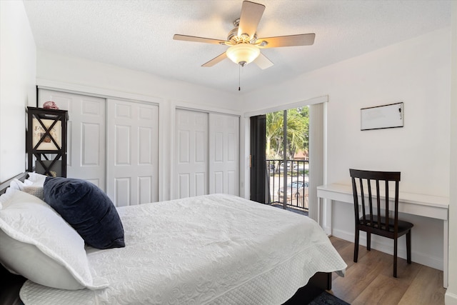 744 Buttonwood Ln Unit 411-D, Boynton Beach, FL 33436 - bedroom featuring access to outside, two closets, wood finished floors, and a ceiling fan