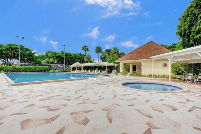 744 Buttonwood Ln Unit 411-D, Boynton Beach, FL 33436 - community pool with a patio area