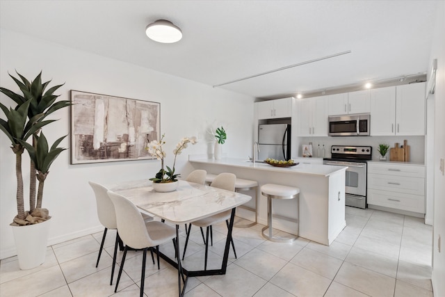 744 Buttonwood Ln Unit 411-D, Boynton Beach, FL 33436 - dining room with light tile patterned floors