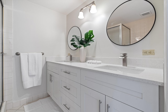 744 Buttonwood Ln Unit 411-D, Boynton Beach, FL 33436 - bathroom with double vanity, a shower with door, and tile patterned floors