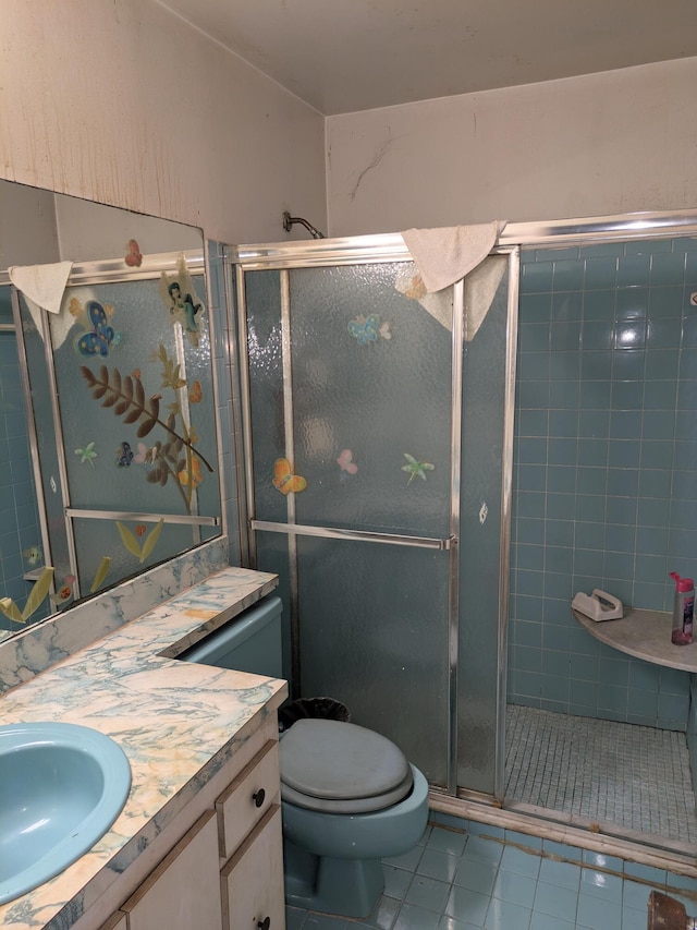 3900 Kenas St, West Palm Beach, FL 33403 - bathroom with vanity, tile patterned flooring, a shower stall, and toilet