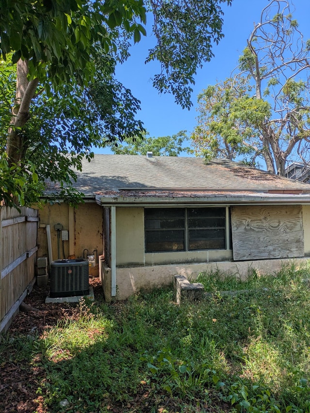 3900 Kenas St, West Palm Beach, FL 33403 - back of property featuring central AC