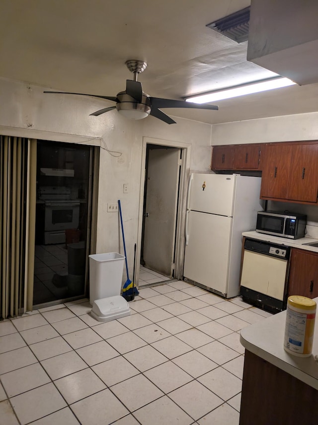 3900 Kenas St, West Palm Beach, FL 33403 - kitchen featuring white appliances, light countertops, ceiling fan, and extractor fan