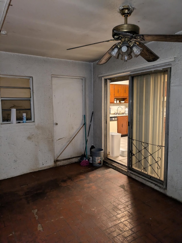 3900 Kenas St, West Palm Beach, FL 33403 - unfurnished room with a ceiling fan, brick patterned flooring, and a sink
