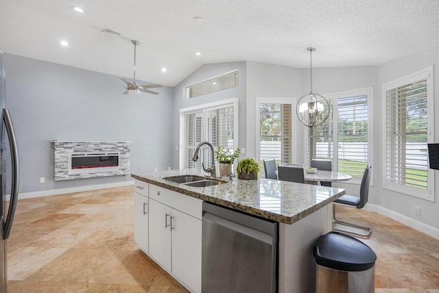 7216 Copperfield Cir, Lake Worth, FL 33467 - kitchen with dishwasher, a sink, healthy amount of natural light, ceiling fan, and vaulted ceiling