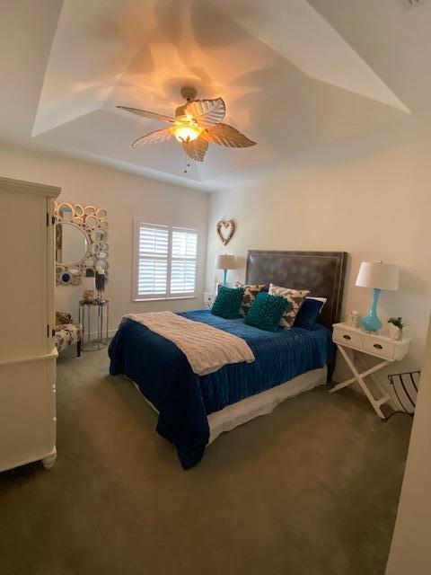 4240 Gator Trace Ave Unit 0, Fort Pierce, FL 34982 - carpeted bedroom with a ceiling fan and a raised ceiling