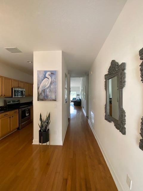 4240 Gator Trace Ave Unit 0, Fort Pierce, FL 34982 - corridor featuring wood finished floors and baseboards