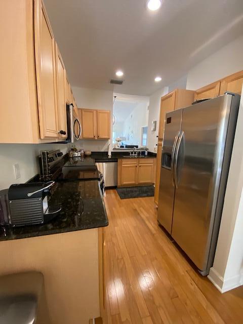 4240 Gator Trace Ave Unit 0, Fort Pierce, FL 34982 - kitchen with stainless steel appliances, light wood-type flooring, recessed lighting, and light brown cabinetry