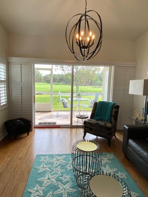 4240 Gator Trace Ave Unit 0, Fort Pierce, FL 34982 - living area with a chandelier and wood finished floors