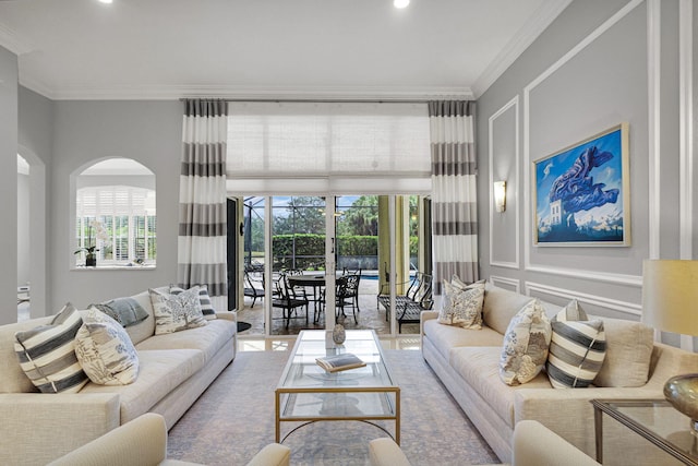 101 Sedona Way, Palm Beach Gardens, FL 33418 - living room featuring crown molding, recessed lighting, and arched walkways