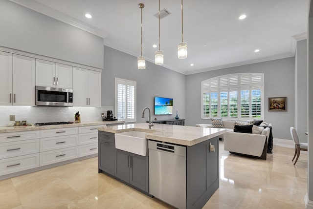 101 Sedona Way, Palm Beach Gardens, FL 33418 - kitchen featuring appliances with stainless steel finishes, a sink, ornamental molding, decorative backsplash, and recessed lighting