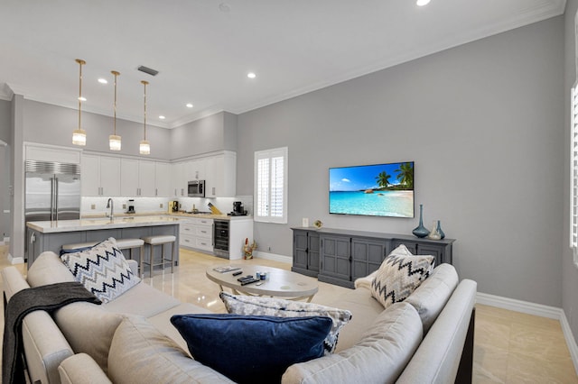 101 Sedona Way, Palm Beach Gardens, FL 33418 - living area with wine cooler, crown molding, baseboards, recessed lighting, and a high ceiling