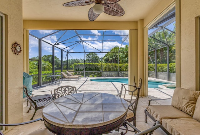 101 Sedona Way, Palm Beach Gardens, FL 33418 - view of patio / terrace featuring a ceiling fan, a lanai, an outdoor pool, view of scattered trees, and outdoor dining area