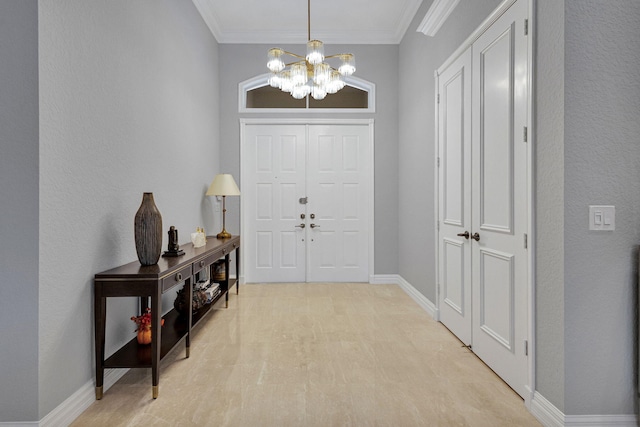 101 Sedona Way, Palm Beach Gardens, FL 33418 - foyer entrance with a chandelier, baseboards, ornamental molding, and light wood-style flooring