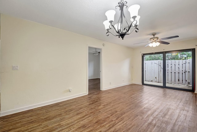 5171 Glencove Ln, West Palm Beach, FL 33415 - spare room featuring a chandelier, wood finished floors, a ceiling fan, and baseboards