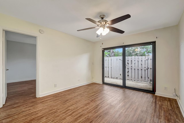5171 Glencove Ln, West Palm Beach, FL 33415 - spare room featuring wood finished floors, ceiling fan, baseboards, and a smoke detector