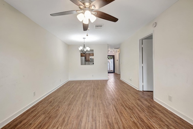5171 Glencove Ln, West Palm Beach, FL 33415 - spare room with a chandelier, ceiling fan, wood finished floors, baseboards, and a smoke detector