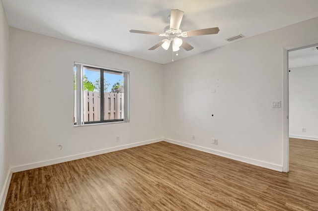 5171 Glencove Ln, West Palm Beach, FL 33415 - spare room with wood finished floors, baseboards, and ceiling fan