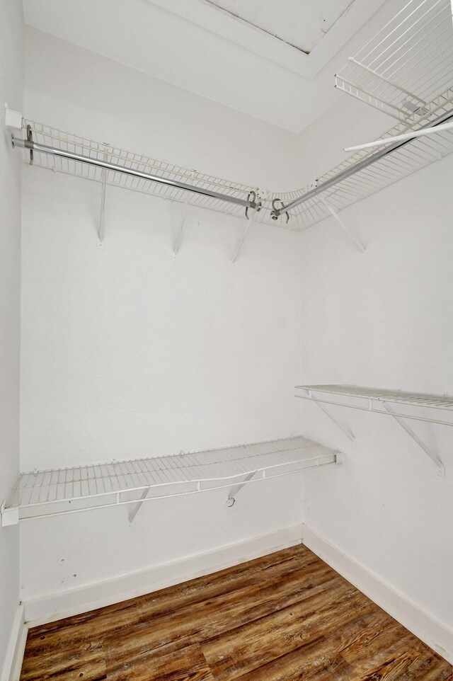 5171 Glencove Ln, West Palm Beach, FL 33415 - walk in closet featuring wood finished floors