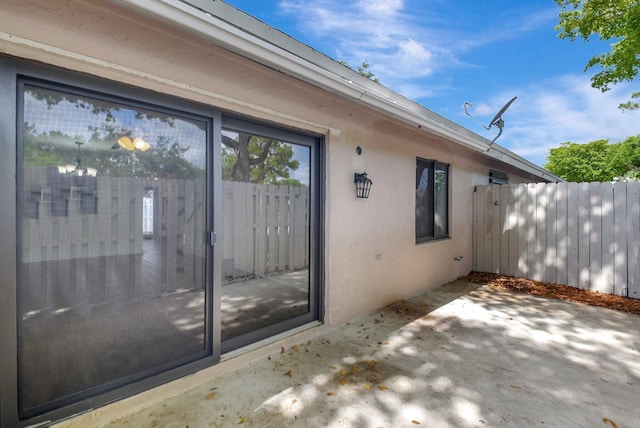 5171 Glencove Ln, West Palm Beach, FL 33415 - property entrance featuring a patio area and stucco siding