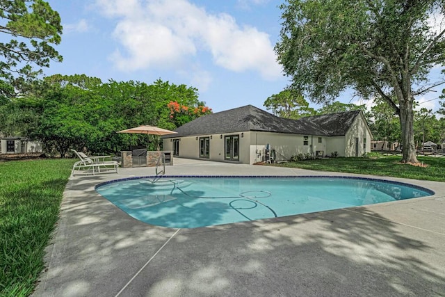 18228 48th Ave N, The Acreage, FL 33470 - outdoor pool featuring a patio area and a lawn