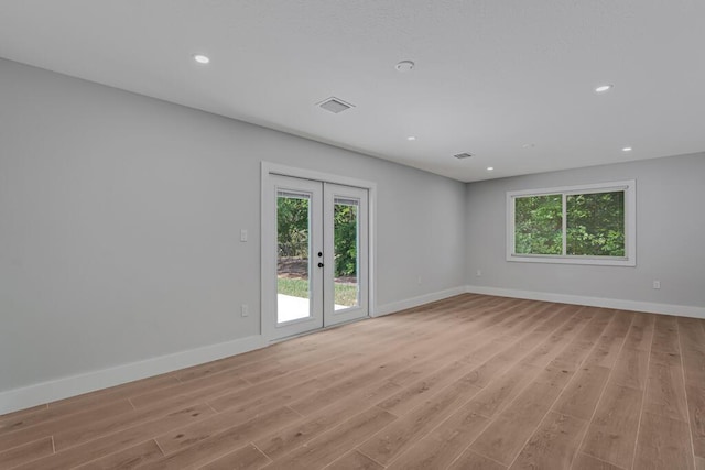 18228 48th Ave N, The Acreage, FL 33470 - unfurnished room featuring light wood-style flooring, baseboards, recessed lighting, and french doors