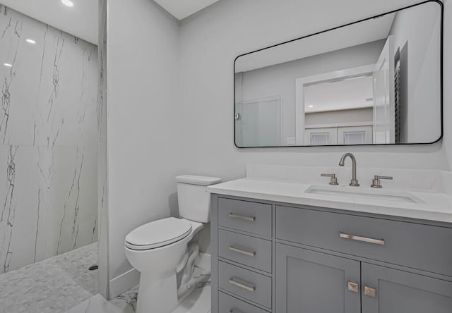 18228 48th Ave N, The Acreage, FL 33470 - bathroom featuring marble finish floors, vanity, a marble finish shower, toilet, and recessed lighting