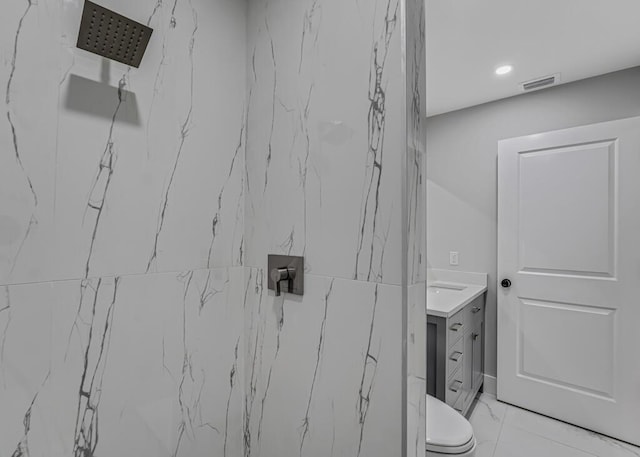 18228 48th Ave N, The Acreage, FL 33470 - bathroom with toilet, a marble finish shower, vanity, marble finish floors, and recessed lighting