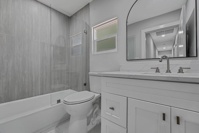 18228 48th Ave N, The Acreage, FL 33470 - bathroom with vanity, toilet, marble finish floors, and washtub / shower combination